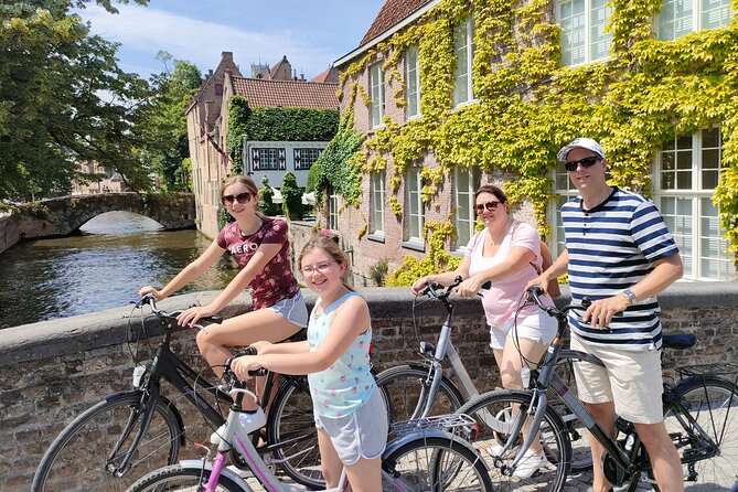 Bruges by bike with friends and family! - The windmill and the canal-side hospital