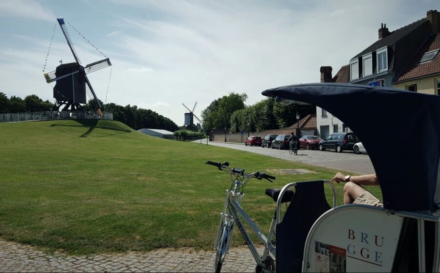 Bruges: Private Guided Tour by Pedicab - Why the covered pedicab matters