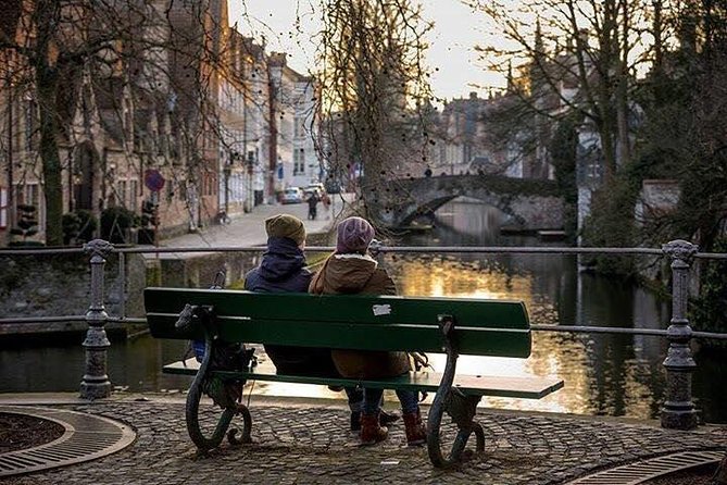 Bruges Uncovered: Historic Walking Tour & Canal Boat Experience - Minnewater and the Beguinage: a quiet opening