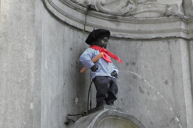 Brussels 2-Hours Walking Tour: Must-See Highlights in the Center - Sablon gardens, guild symbols, and antique stalls