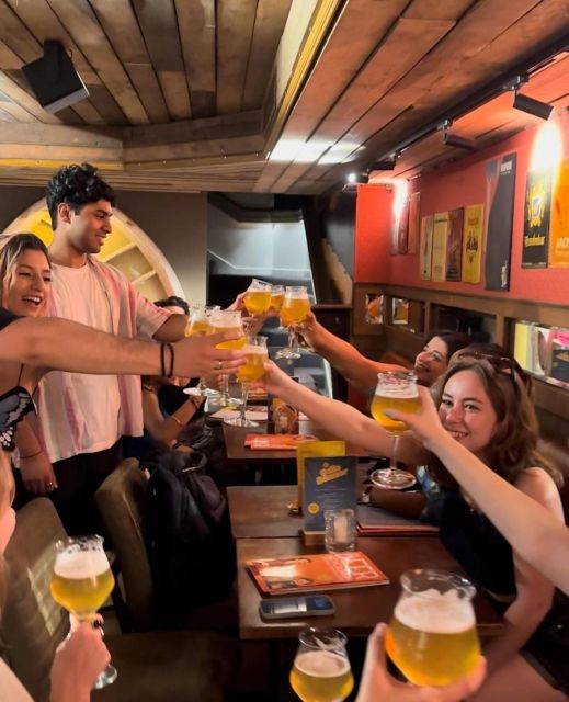 Brussels Tipsy Tour: Cocktail Making, Painting & Chocolates - Painting a Manneken Pis statue with a drink in hand