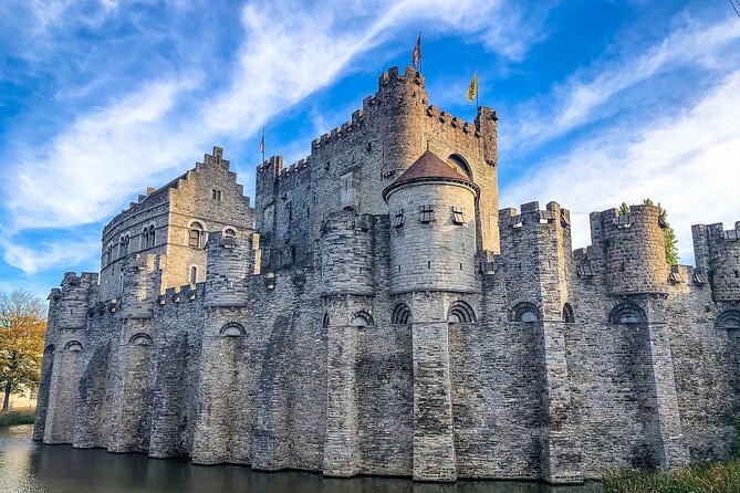 Ghent and Bruges Full Day Tour from Brussels - Ghent begins with stone, towers, and a castle