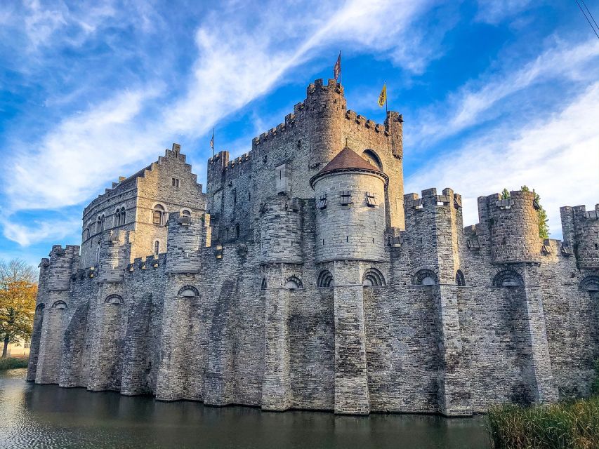Ghent: Guided Walking Tour and Canal Boat Trip - Guide style, group rhythm, and the amount of information